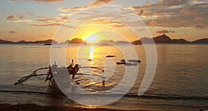 Banka, traditional filipino boat, at sunset in the Philippines