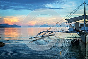 Banka, traditional filipino fishing boat at sunset, Cebu island The Philippines