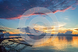 Banka, traditional filipino fishing boat at sunset, Cebu island The Philippines