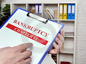 Banker reads the chapter 11 of the bankruptcy law.