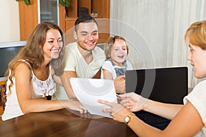 Banking assistant and satisfied family
