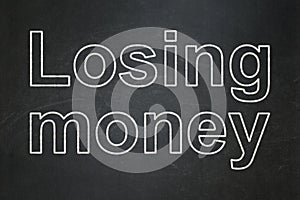 Banking concept: Losing Money on chalkboard background