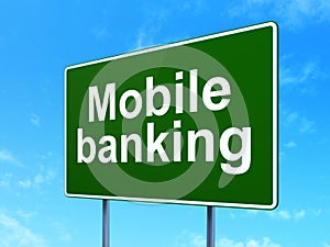 Banking concept: Mobile Banking on road sign background