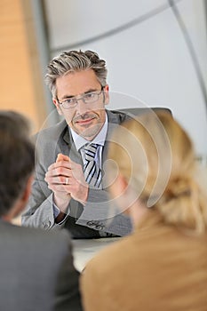 Banking consultant listening to clients