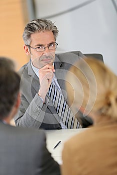 Banking consultant listening to clients