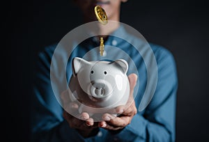 Banking and Saving money, coin falling to piggybank income earning money or investment retirement planning and insurance