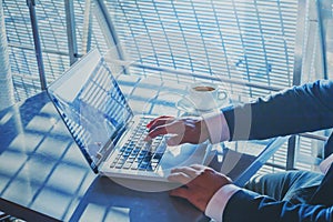 Banking or shopping online, e-commerce concept, closeup of hands and keyboard