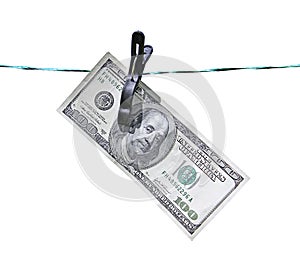 The banknote one hundred dollars on the clothesline isolated