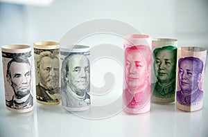 Banknote roll, dollar roll and yuan roll. economy chess competition concept.money roll for playing chess.