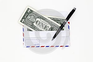 Banknotes in airmail envelope with black pen on white background.