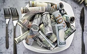 Banknotes of American cash dollar bills of various denominations are poured into a plate as a symbol of spending money on food