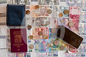 banknotes and coins of different currencies with passport, wallet and mobile phone, Euro CHF CZK PLN IDR