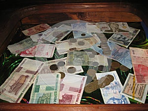 Banknotes and coins are on the table