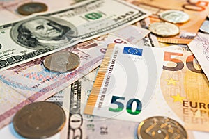 Banknotes of different currencies. Coins and cash, currency exchange. Travelling and tourism