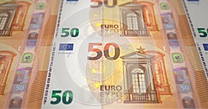 Banknotes fifty euros passing on screen