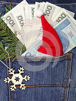 Banknotes in jeans pocket on Christmas gifts - Christmas shopping