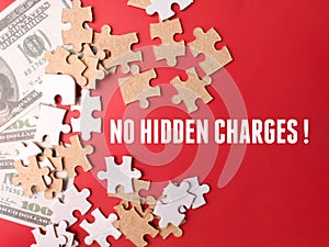 Banknotes and jigsaw puzzle with word NO HIDDEN FEES on red background.