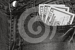 Banknotes, money in a jeans pocket, close up. Money stick out of the jeans pocket, finance and currency concept. Concept of rich