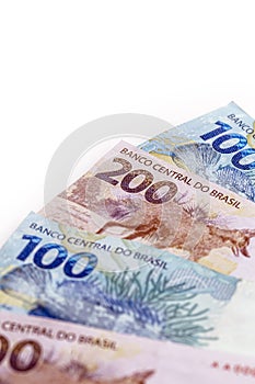 Banknotes of 100 and 200 reais, money from brazil. Concept of Brazilian economy, economic growth photo