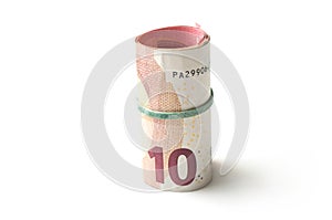 banknotes roll of ten euros money on white background