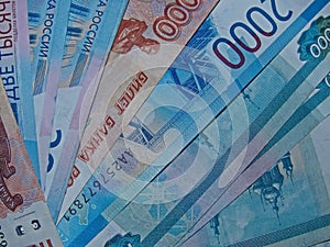 Banknotes of the Russian Federation with a nominal value of 1 000, 2 000 and  5 000 rubles.