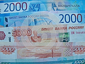 Banknotes of the Russian Federation with a nominal value of 1 000, 2 000 and  5 000 rubles.