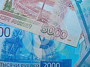 Banknotes of the Russian Federation with a nominal value of 1 000, 2 000 and  5 000 rubles.