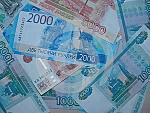 Banknotes of the Russian Federation with a nominal value of 1 000, 2 000 and  5 000 rubles.
