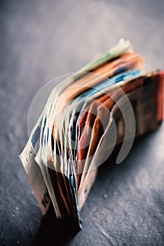 Banknotes on a stone background. Euro money bank notes of different value. European currency - Euro.