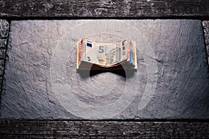 Banknotes on a stone background. Euro money bank notes of different value. European currency - Euro.