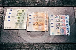 Banknotes on a stone background. Euro money bank notes of different value. European currency - Euro.