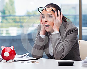 The bankrupt broke businesswoman with piggy bank