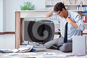 The bankrupt businessman angry in the office floor