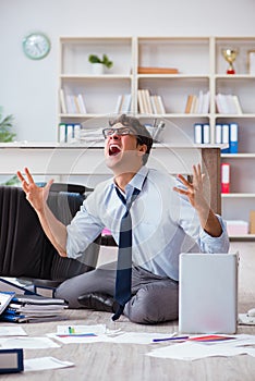 The bankrupt businessman angry in the office floor