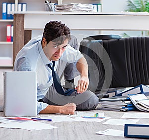 Bankrupt businessman angry in the office floor