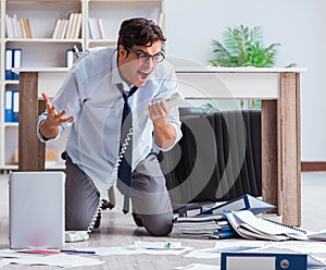 Bankrupt businessman angry in the office floor