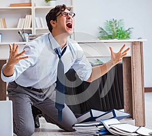 Bankrupt businessman angry in the office floor