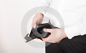 Bankruptcy - Business Person holding an empty wallet. Man showing  the inconsistency and lack of money and not able to pay the
