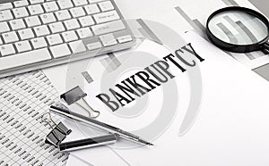 COMPOUND INTEREST text on paper with keyboard on grey background