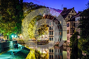 The banks of the Ill canal at nightfall in the Petite France quarter in Strasbourg, France