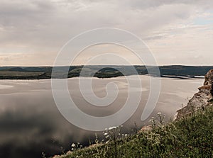 The banks of a large river. A calm smooth water view. The landscape of Bakota Bay on the Dniester river, Ukraine.