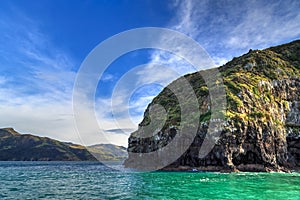 Banks Peninsula, New Zealand. Cliffs at the entrance to Akaroa harbour