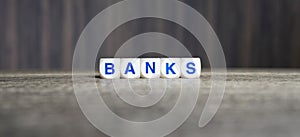 Banks word cubes on dark background