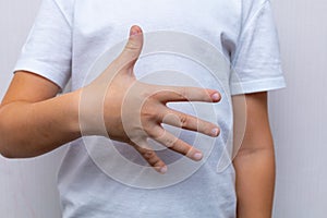 Banner of an adorable little child& x27;s hands gesture in heart shape showing love and kindness.