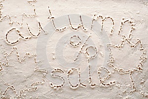 Banner for autumnal sale on white sand