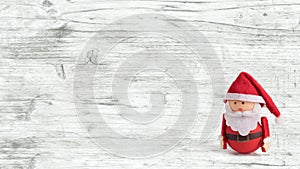 Banner, backdrop or background with a cute Santa Claus Doll with copy space. Suitable for Christmas cards. Isolated Christmas doll