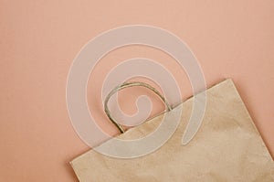 Banner on beige background with ecological paper bag for seasonal and holiday shopping