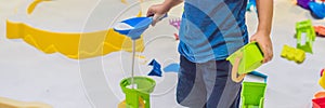 BANNER Boy playing with sand in preschool. The development of fine motor concept. Creativity Game concept long format