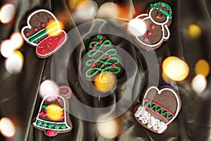 Banner for Christmas and New Year gingerbread. Christmas trees, toys, snowmen, garlands on a background of brown silk