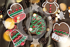 Banner for Christmas and New Year gingerbread. Christmas trees, toys, snowmen, garlands on a background of brown silk